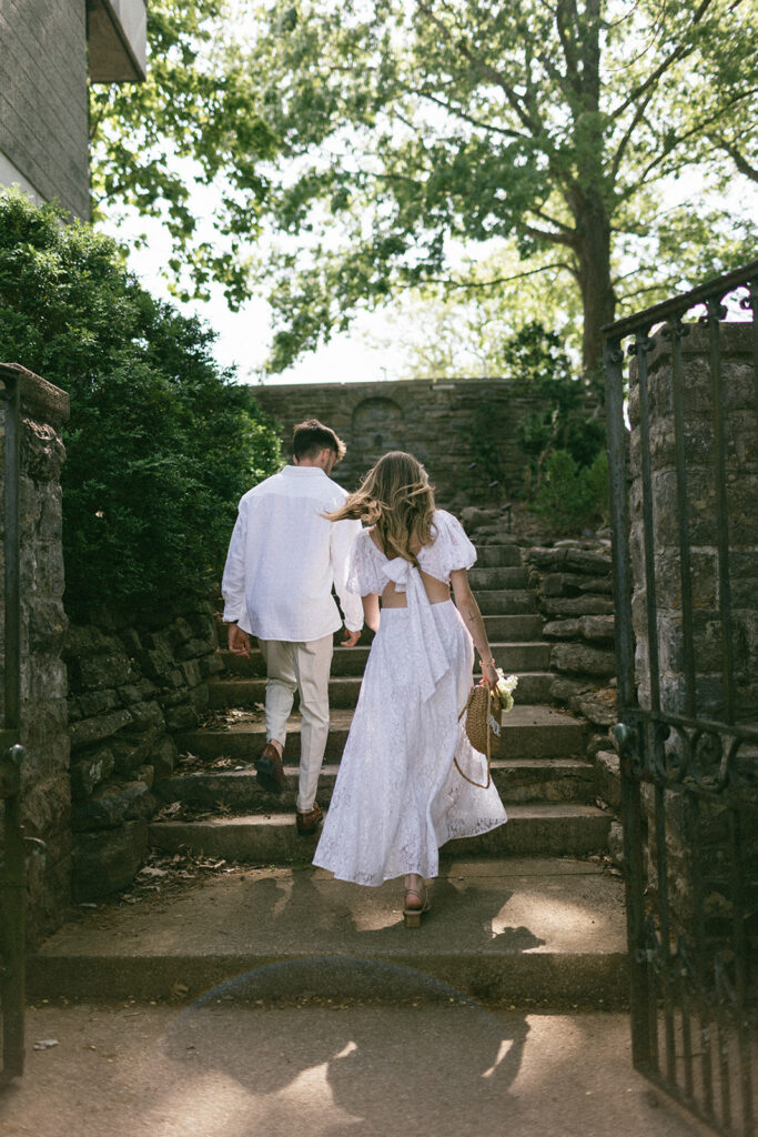 couple walking up the stairs at a top wedding venue in nashville tn, cheekwood estate & gardens