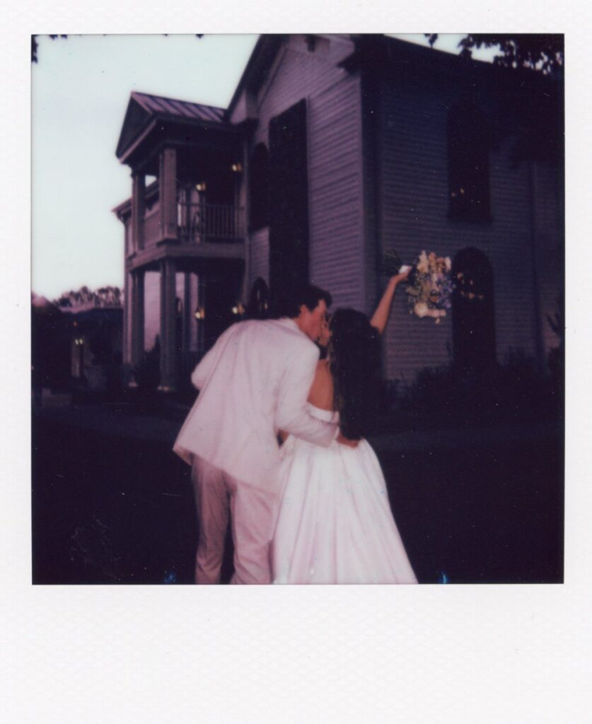 bride and groom standing outside their wedding reception venue in nashville