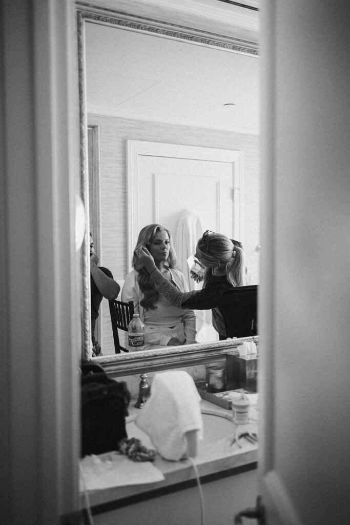 bride getting her makeup done for her nashville wedding