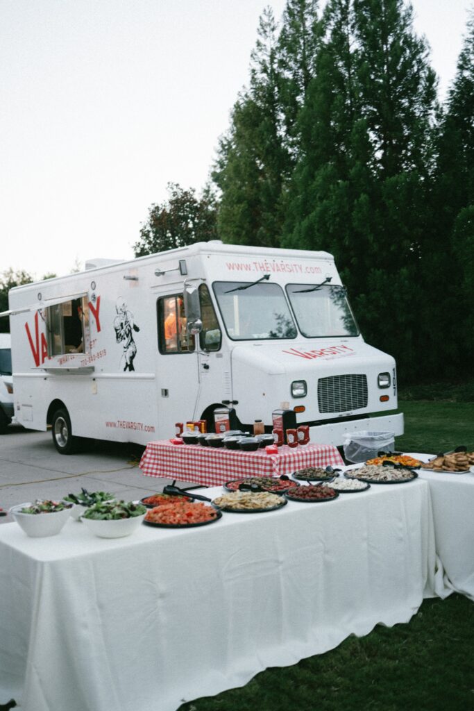 the varsity food truck parked outside for a wedding celebration