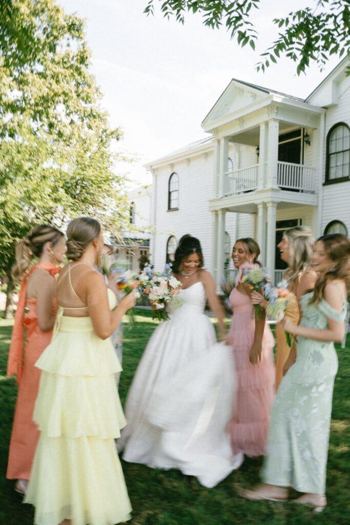 candid photograph of a bride and her bridal party dancing at her nashville wedding