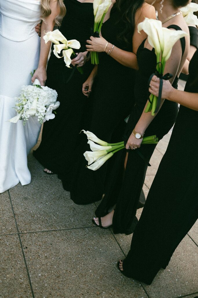 candid photograph of flowers held by a bride and her bridal party at her nashville wedding