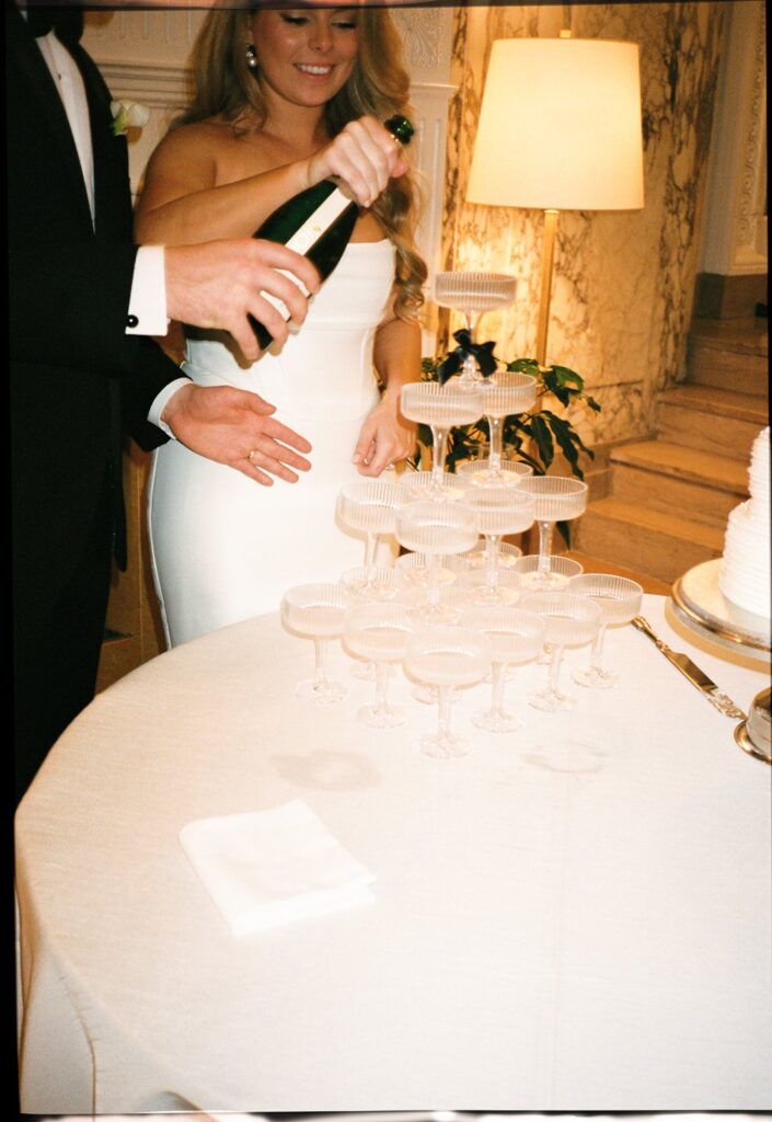 bride and groom pouring champange at their nashville wedding