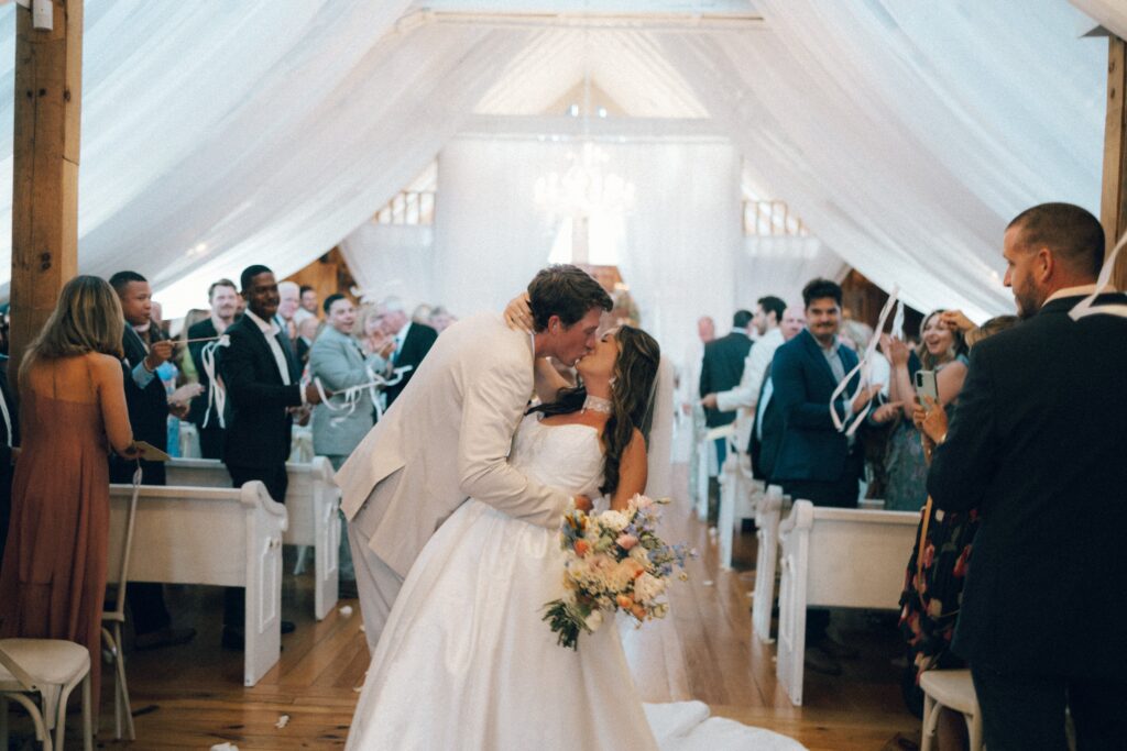 bride and groom kissing after getting married at their nashville wedding