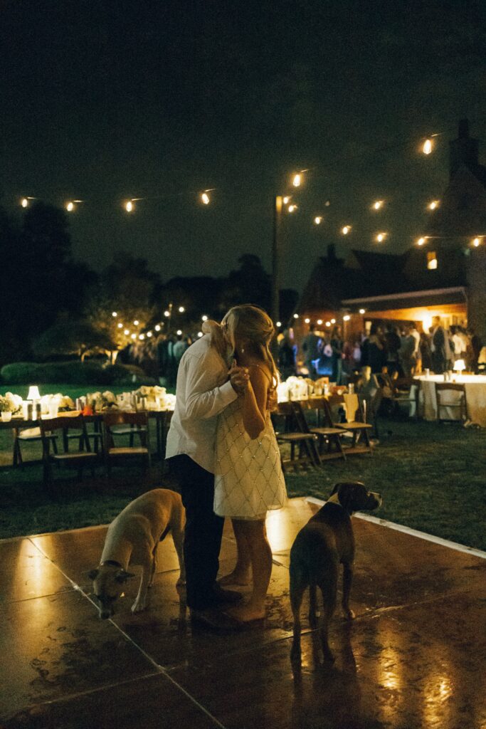bride and groom dancing with their dogs around them during their nashville wedding reception