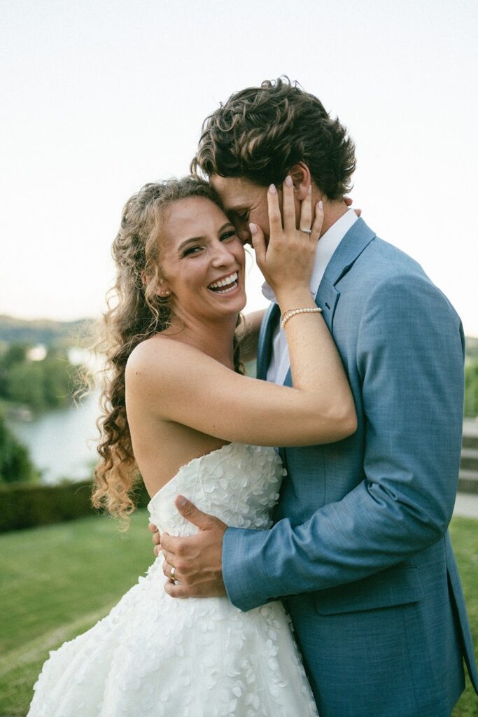 close-up of a joyful bride and groom embracing outdoors, showcasing the candid style of a Nashville TN wedding photographer