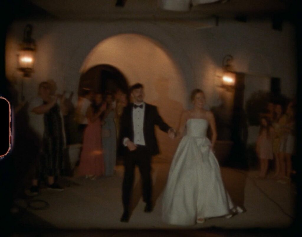 newlyweds running hand in hand through sparkler send-off at a Nashville wedding venue at night