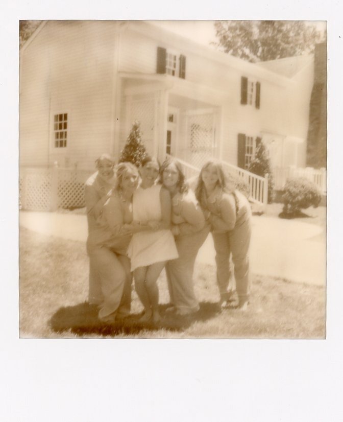 bridal party posing in front of a white Southern home in a vintage-inspired Polaroid taken by wedding photographers in Nashville TN