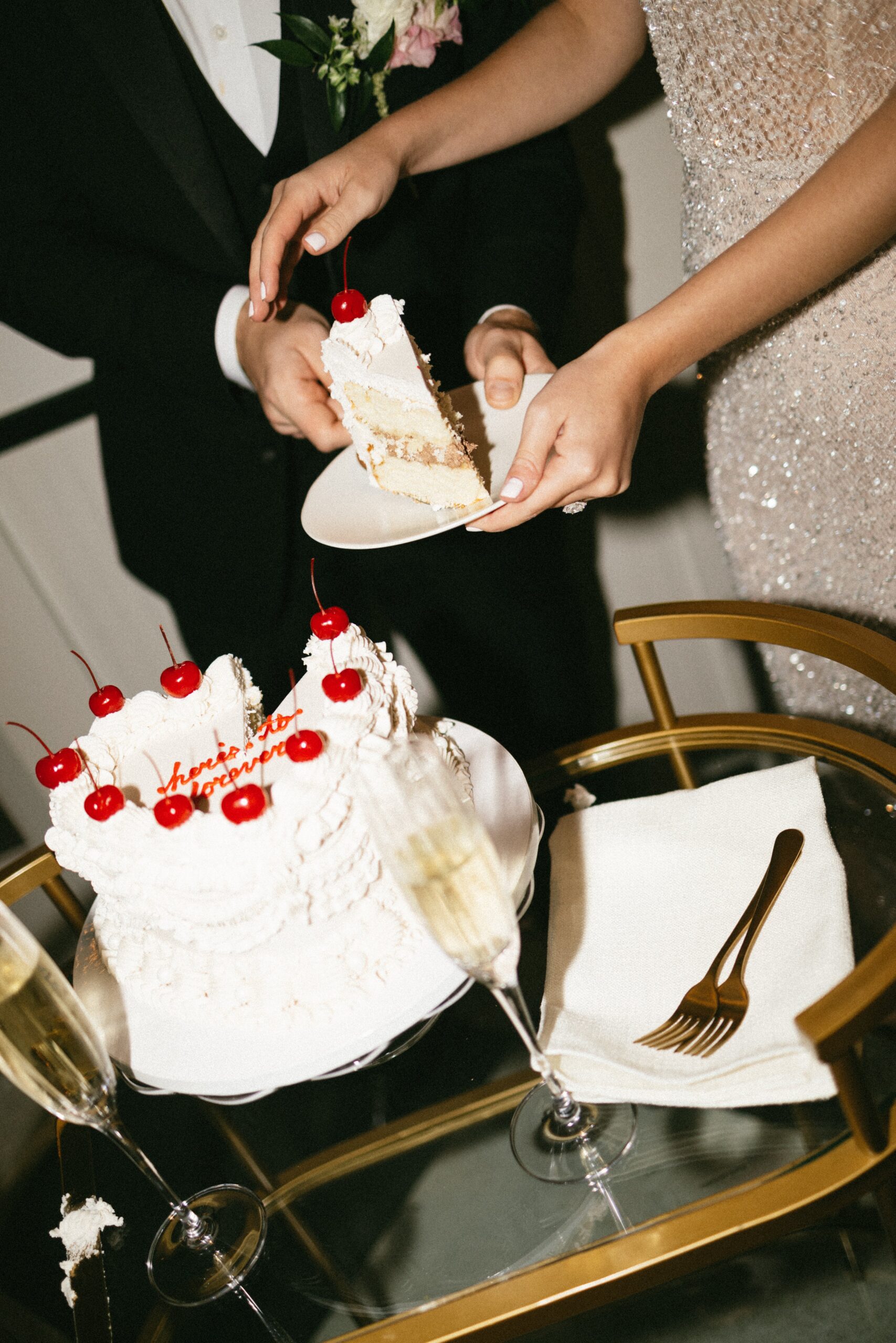 Bride and groom sharing bites of wedding cake during a romantic reception at a small wedding venue in Nashville TN.