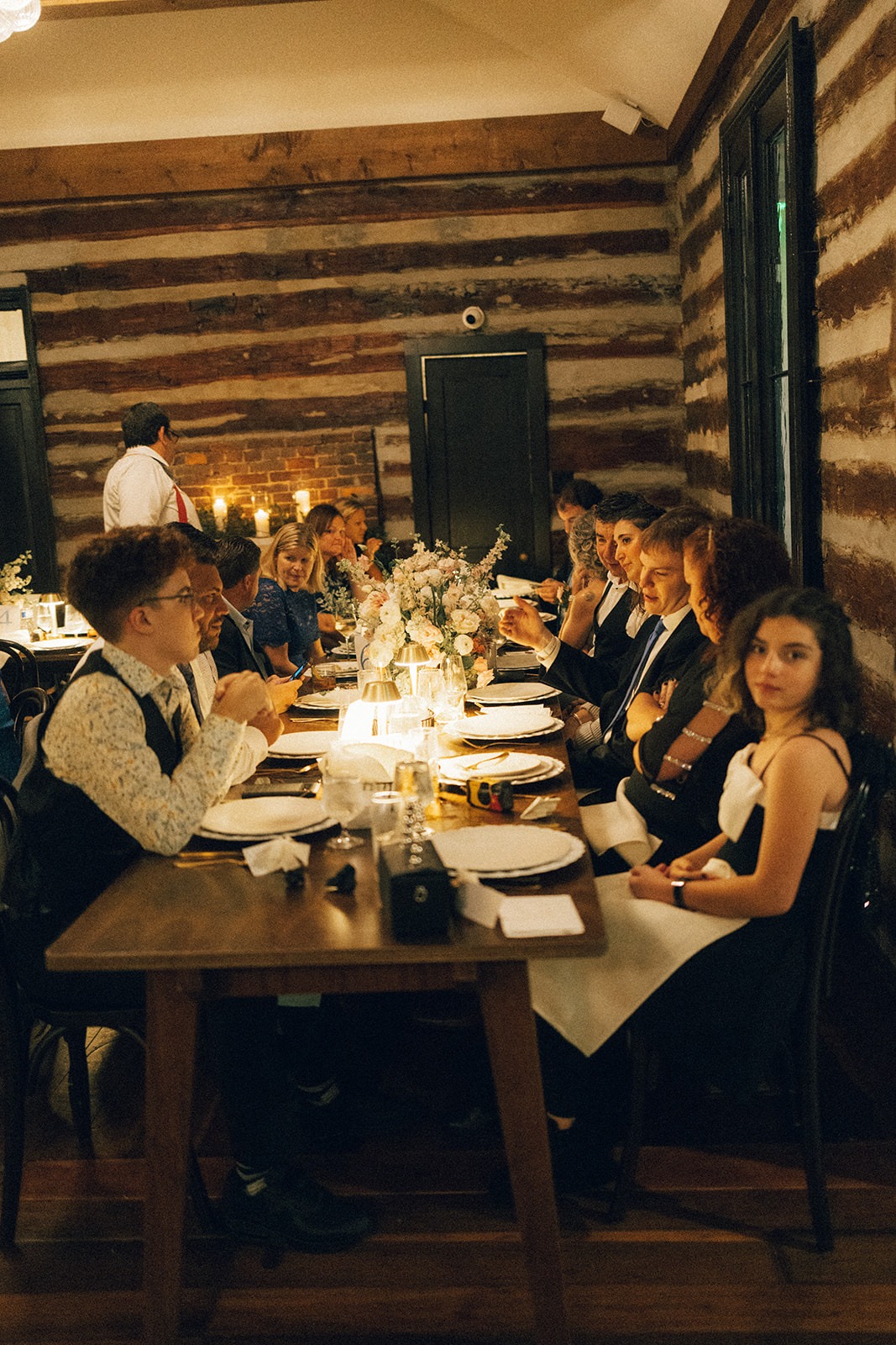 wedding guests seated at an initimate reception dinner hosted at the estelle wedding venue in nashville