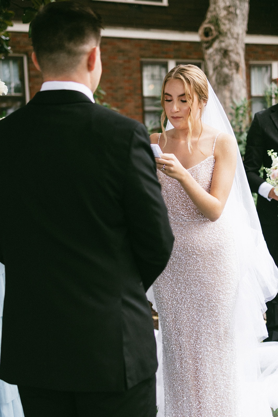 bride reading vows to her groom during their wedding at the estelle nashville wedding venue