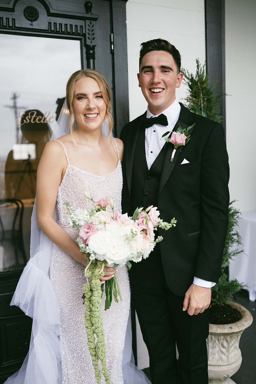 bride and her brother smiling for a photo at the estelle nashville