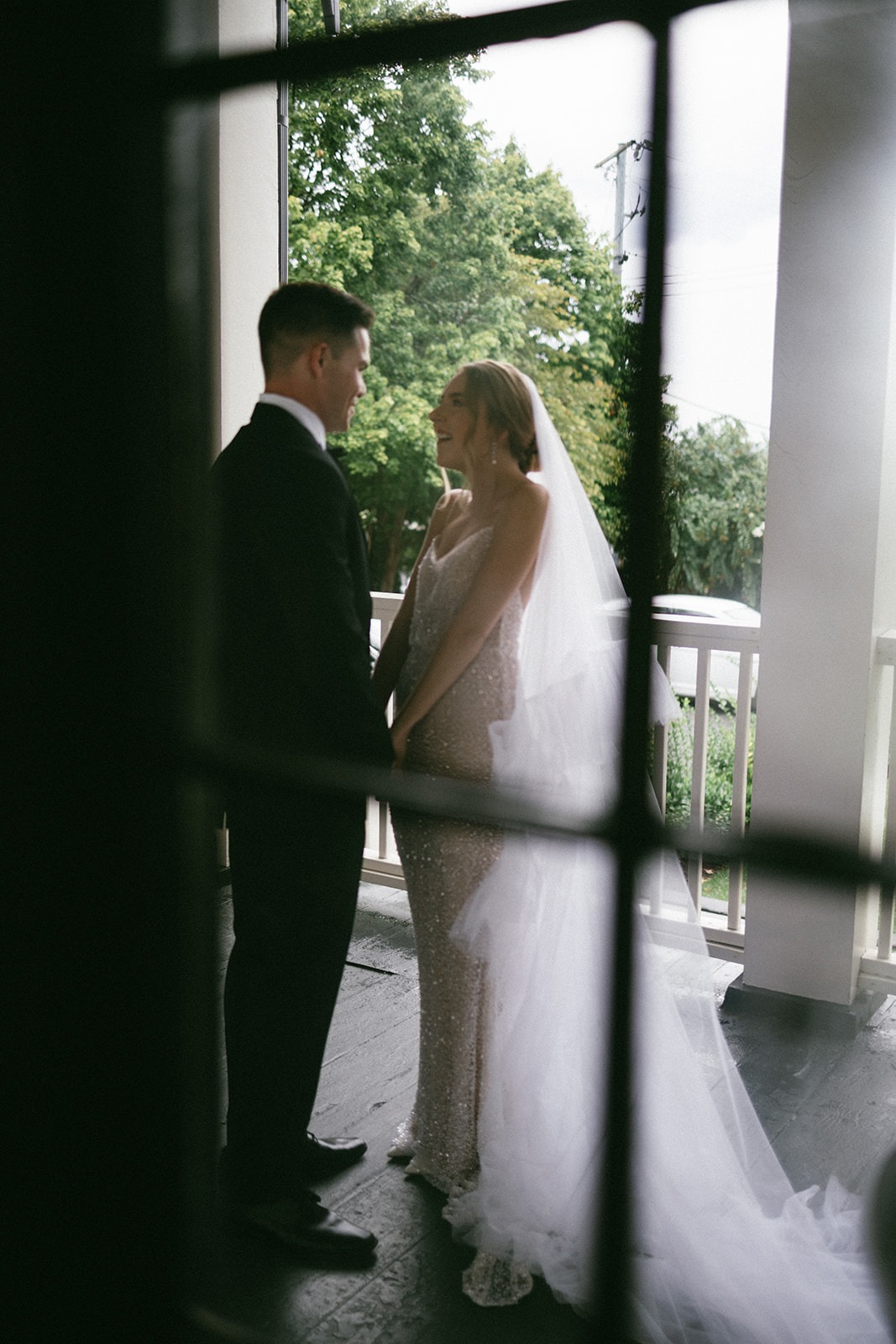 candid estelle nashville photos of a bride and groom sharing a laugh during their first look moment