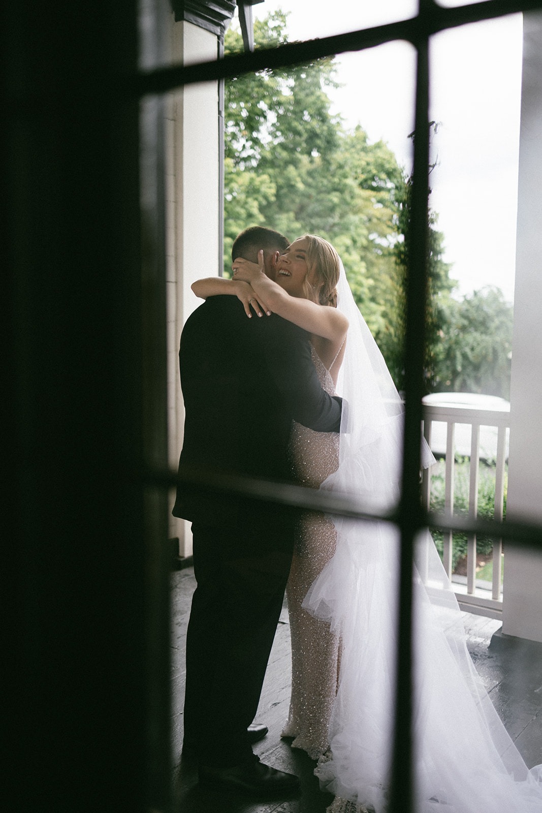 candid estelle nashville photos of a bride and groom sharing a hug during their first look moment